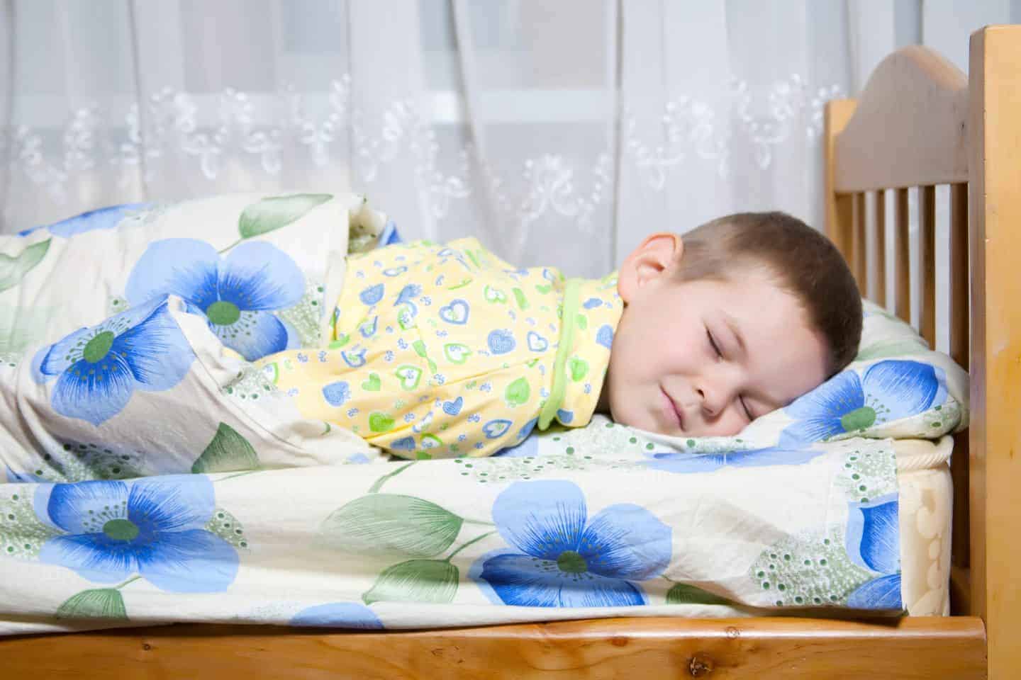 A child asleep in bed
