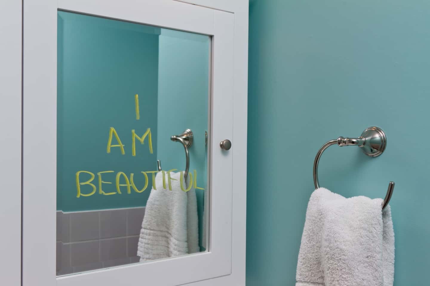 Positive message in bathroom mirror