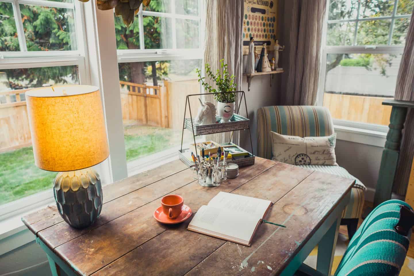 wooden table in front of a mirror with a coffee