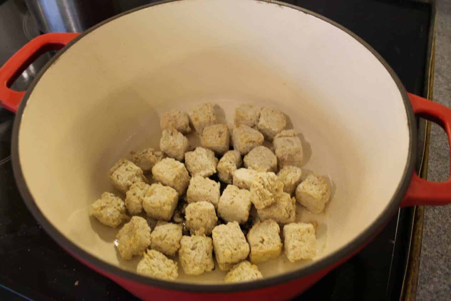 Frozen quorn pieces in a large pan