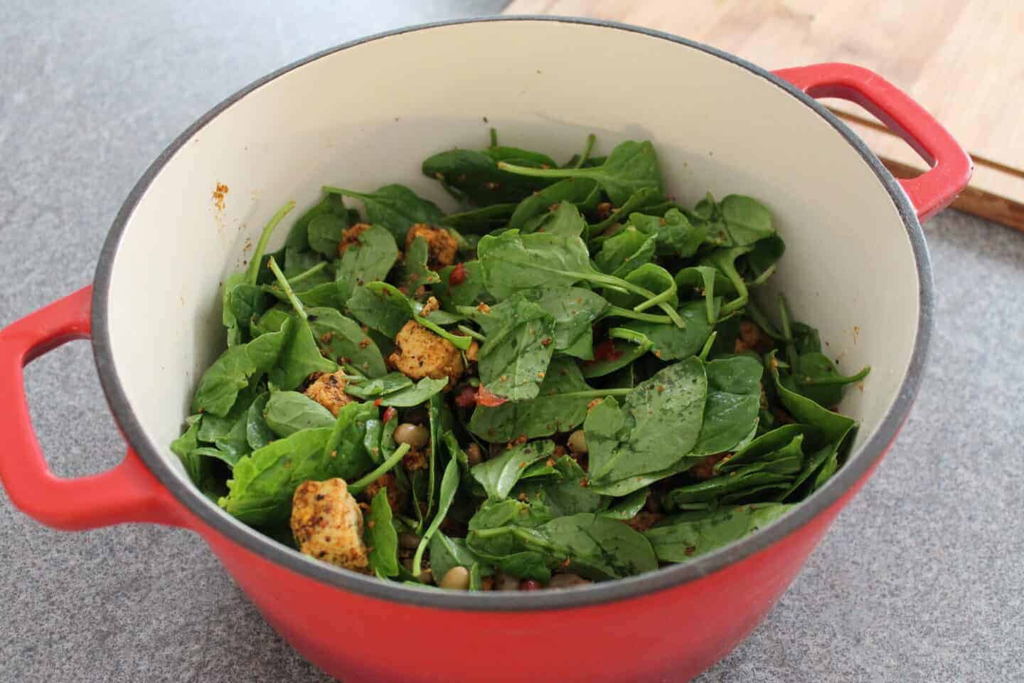 Mixing the ingredients of the mexican salad