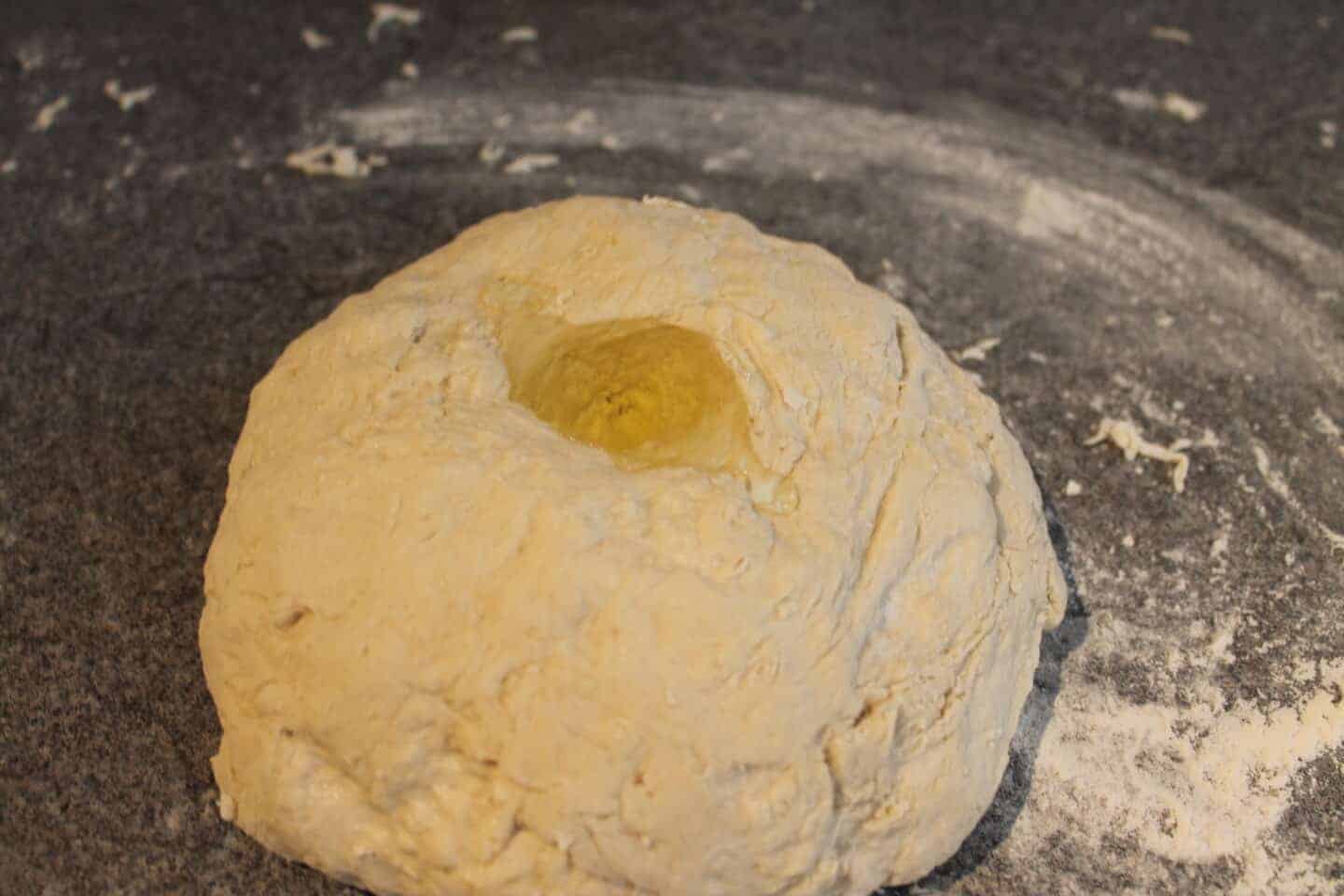 pizza dough with oil in the middle