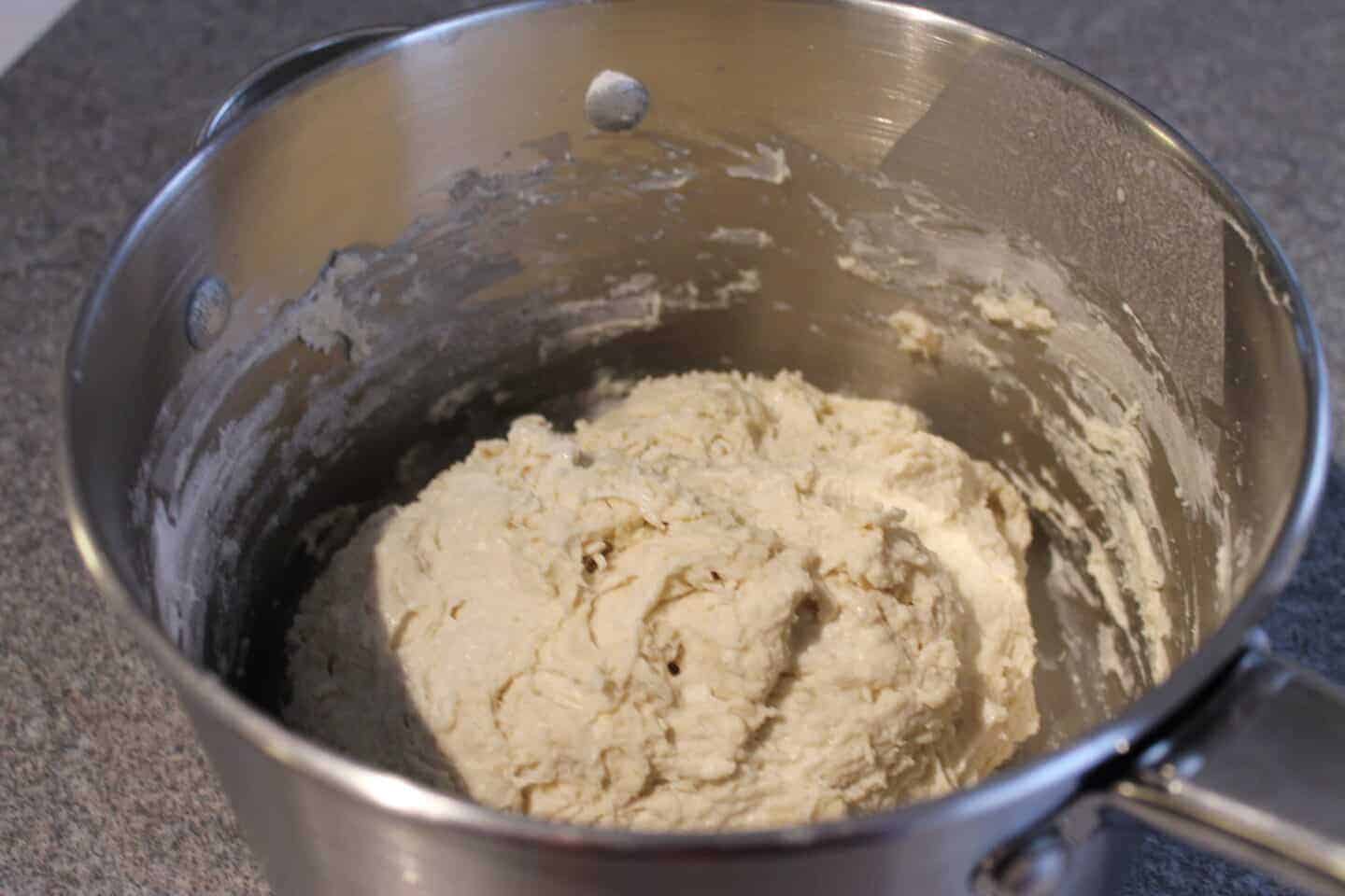 dough mixed in a metal pan