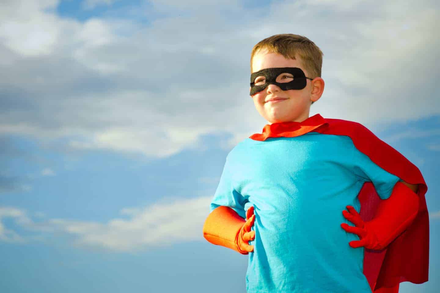 boy pretending to be a superhero