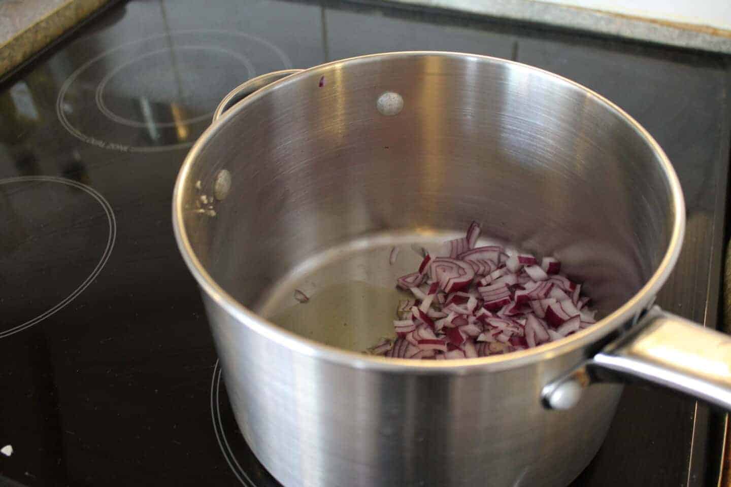 metal pan containing chopped red onion