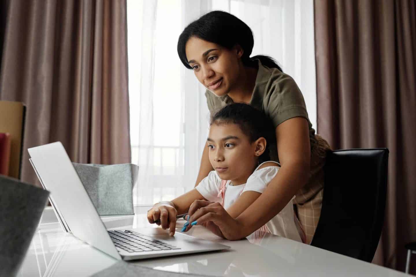 parent helping with school work at home