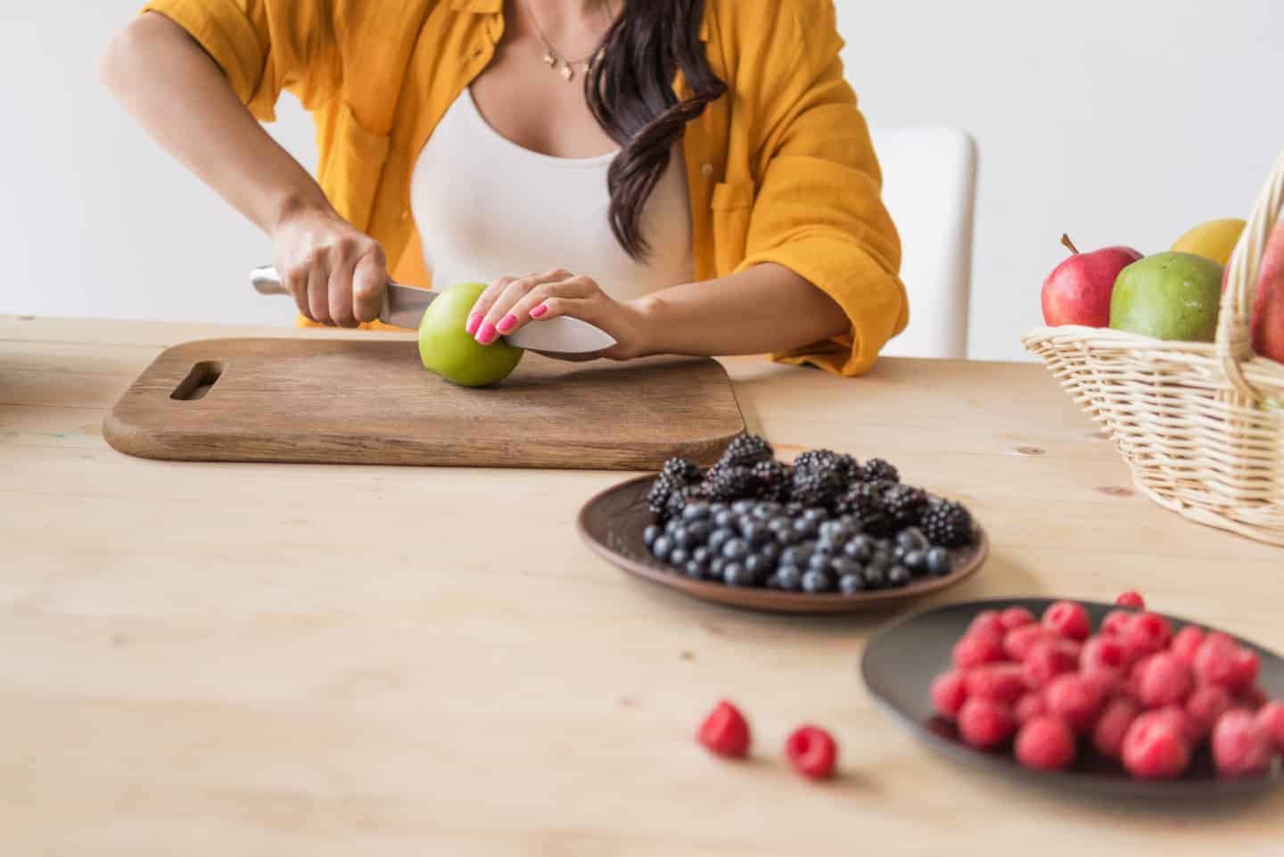 lady cutting an apple