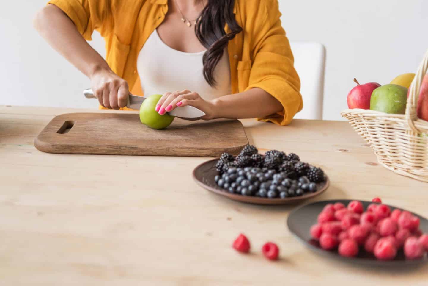 lady cutting an apple