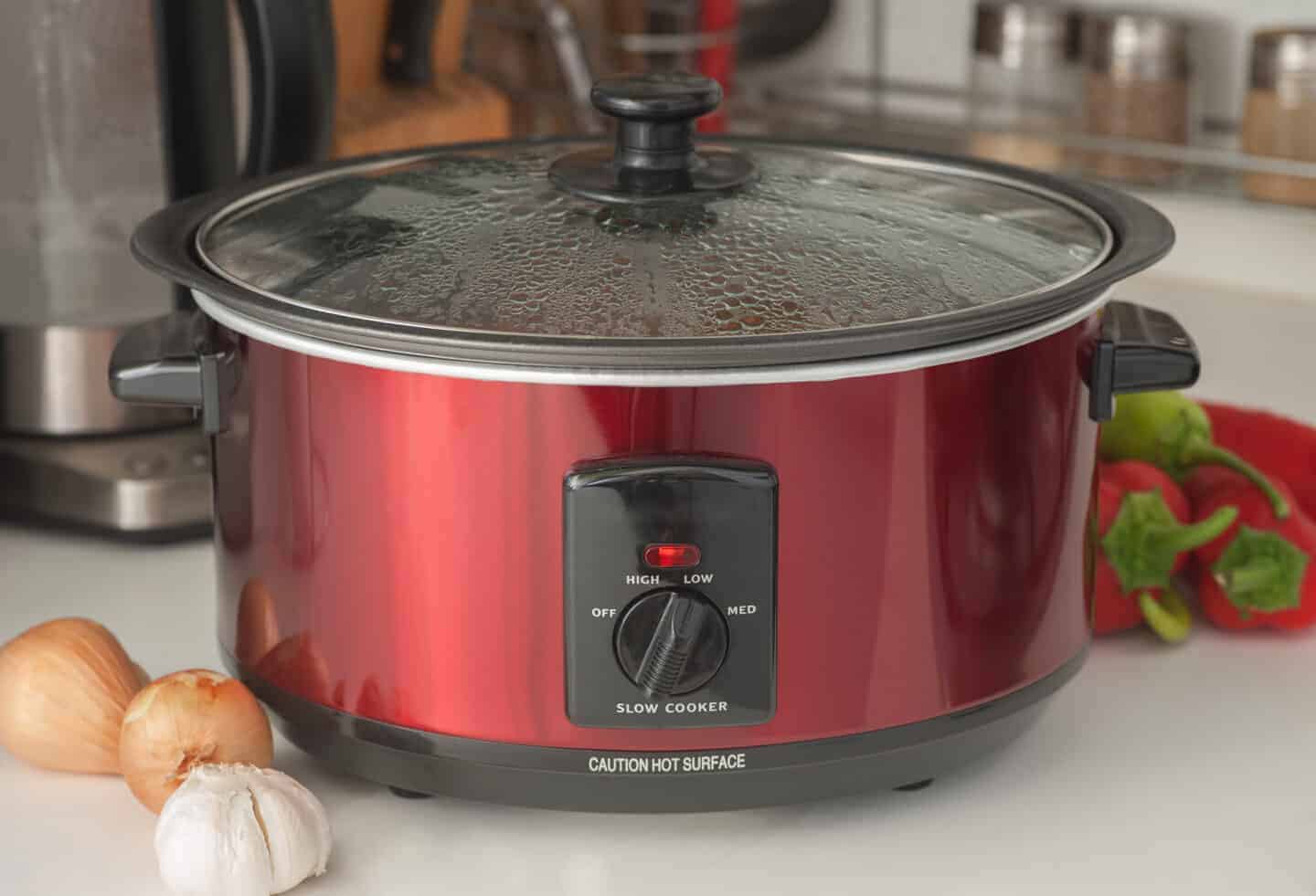 close up of a slow cooker on a worksop