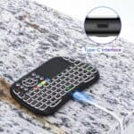 Portable mini wireless keyboard with touchpad and Type-C interface, ideal for smart TV, Android, iOS, PC, and gaming. Compact design perfect for travel and remote control.
