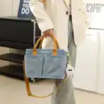 Sac à langer bébé multifonction, spacieux et élégant, idéal pour parents nomades.