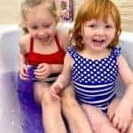 Playing in the Glitter slime baff