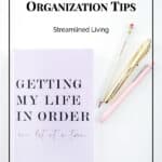 purple notebook with pastel pencils on white desktop