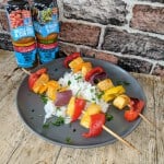 Kebabs and rice on black plate