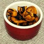 Sticky mushrooms in a red ramekin