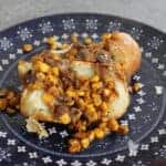jacket potato topped with herby sweetcorn onion and mushroom topping