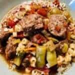 Italian meatball soup in white bowl