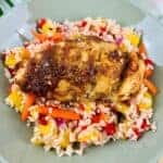 Caribbean rice topped with a jerk chicken breast.