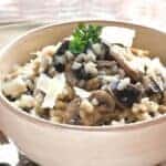 Garlic mushroom risotto in a beige bowl