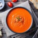 Tomato soup in a dark bowl