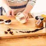 Person producing bio beauty care products with coconut mass