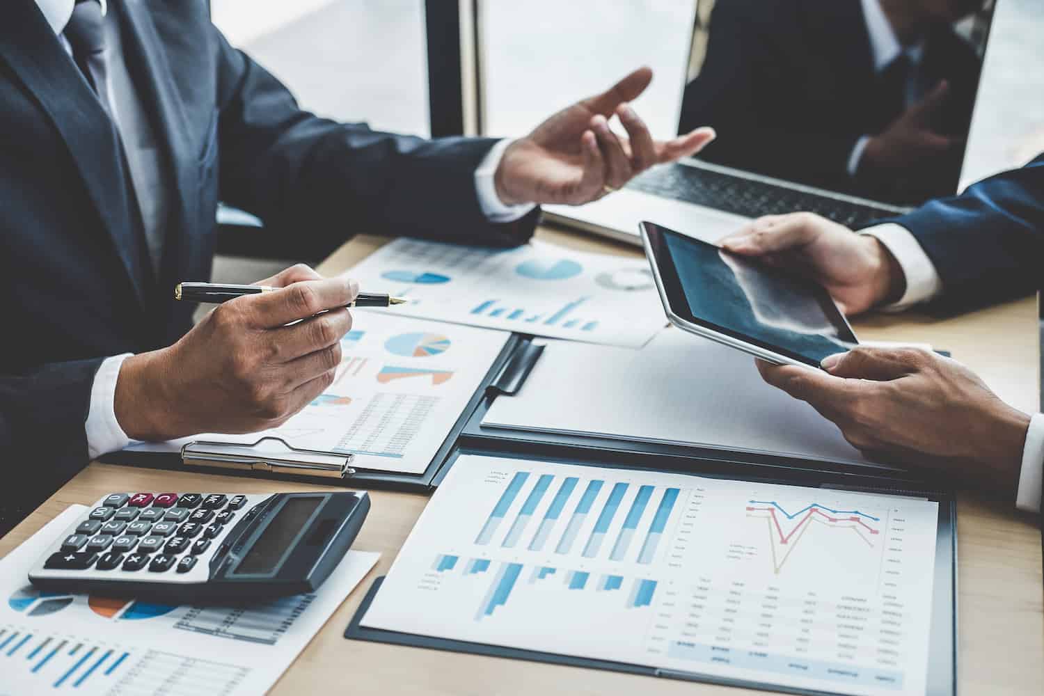Finance manager meeting discussing company growth project success financial statistics, professional investor working start up project for strategy plan with document, laptop and digital tablet Maximizing insights with financial modeling