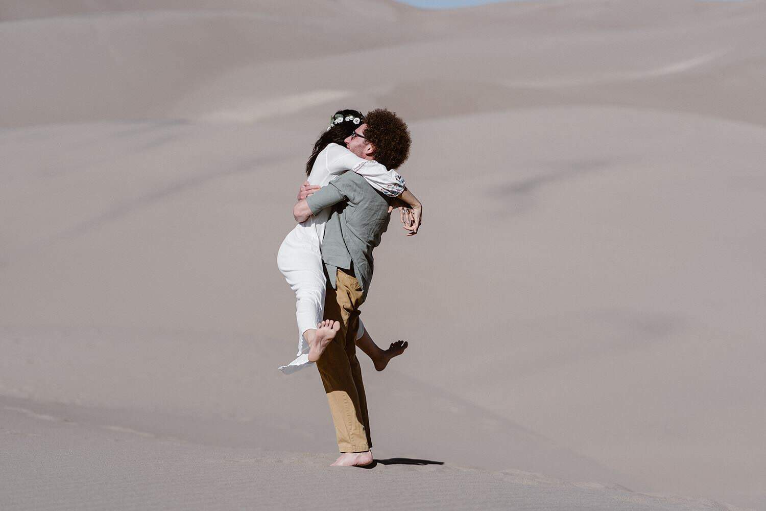 Bride and Groom hugging at Colorado Great Sand Dunes Elopement