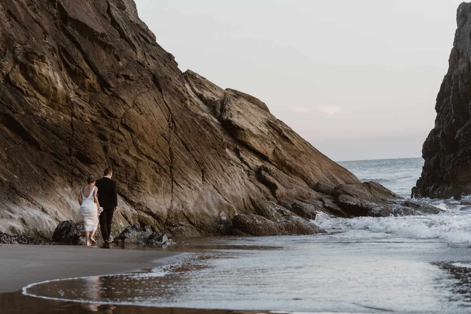 Bride and Groom near ocean at Hug Point & Cannon Beach Elopement