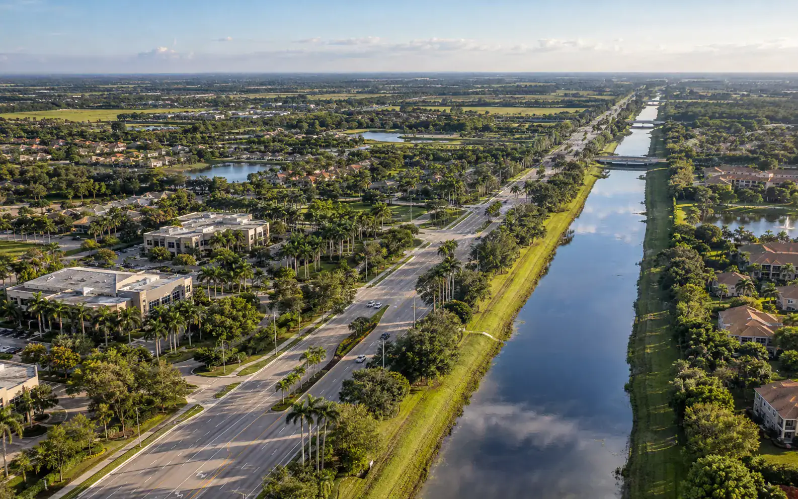 Aerial view of a western Palm Beach County roadway and canal connecting Wellington with nearby communities