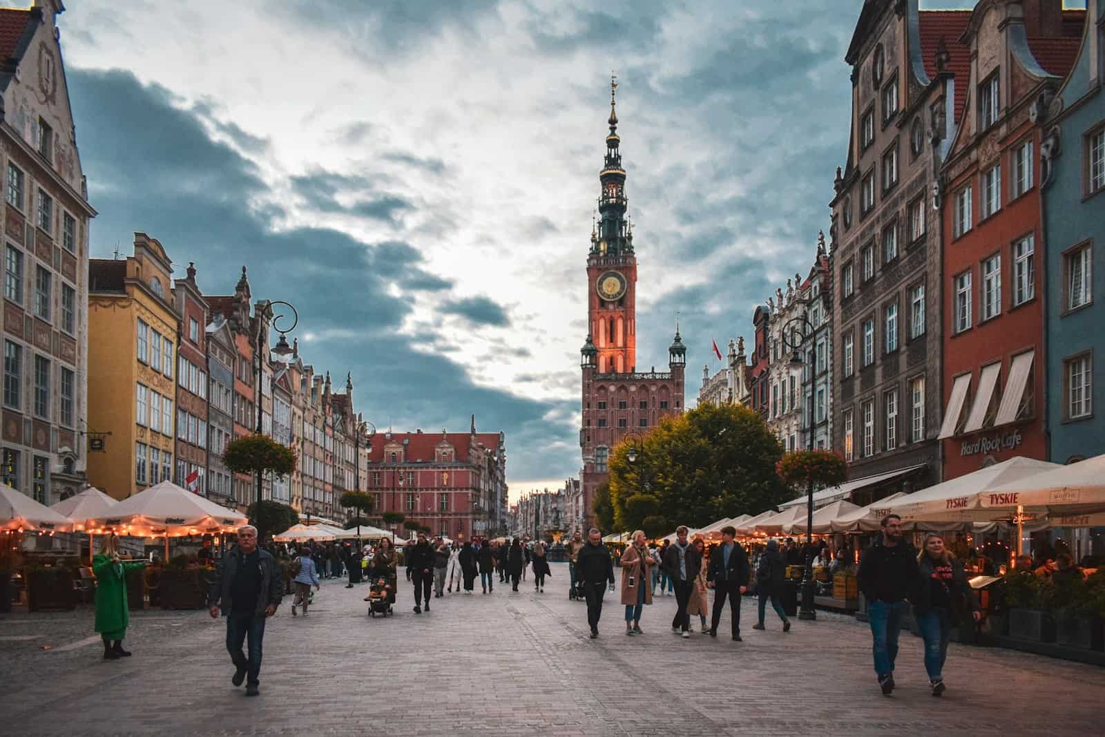 a group of people walking in a city