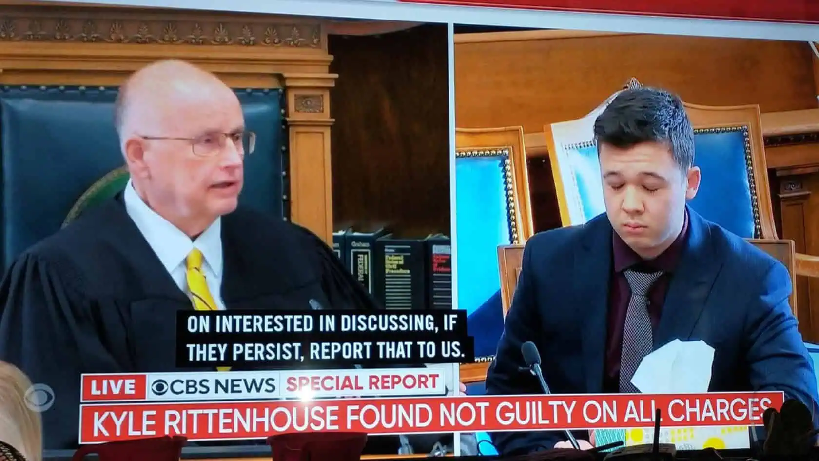 A CBS News Screenshot of Kyle Rittenhouse as he reacts to the "Not Guilty" verdict.