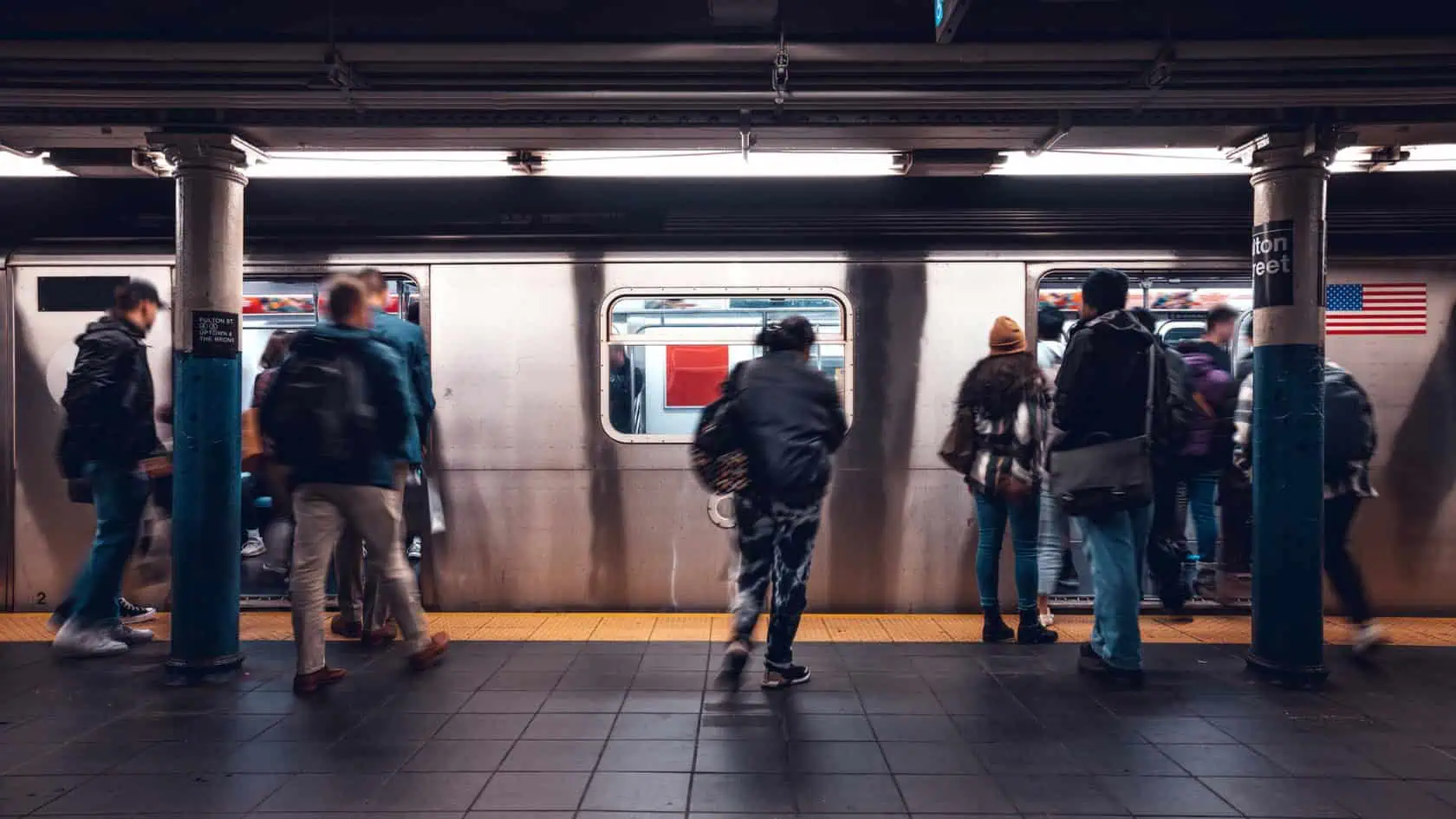 Passengers enter a New York City subway.