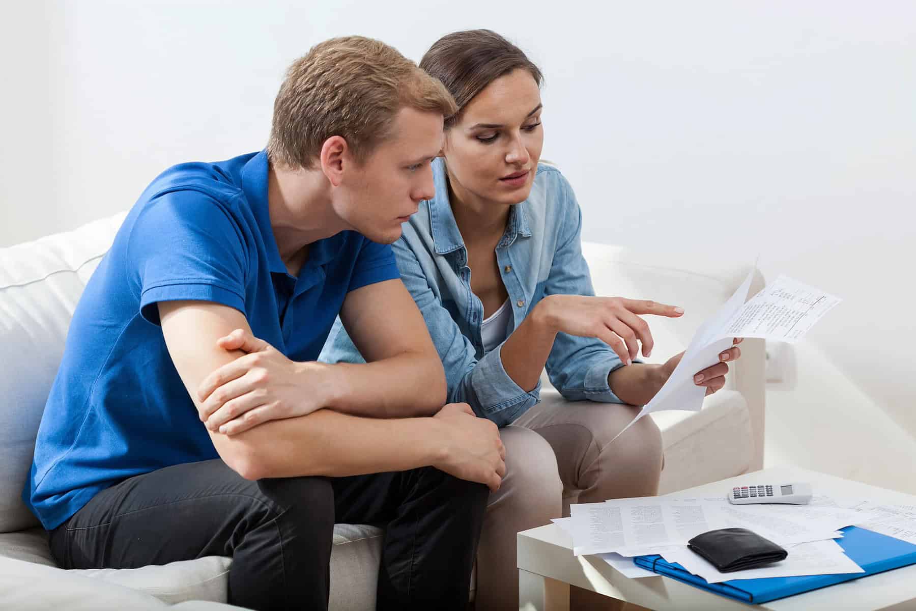 Homeowners Discussing Ways To Lower Insurance Premiums