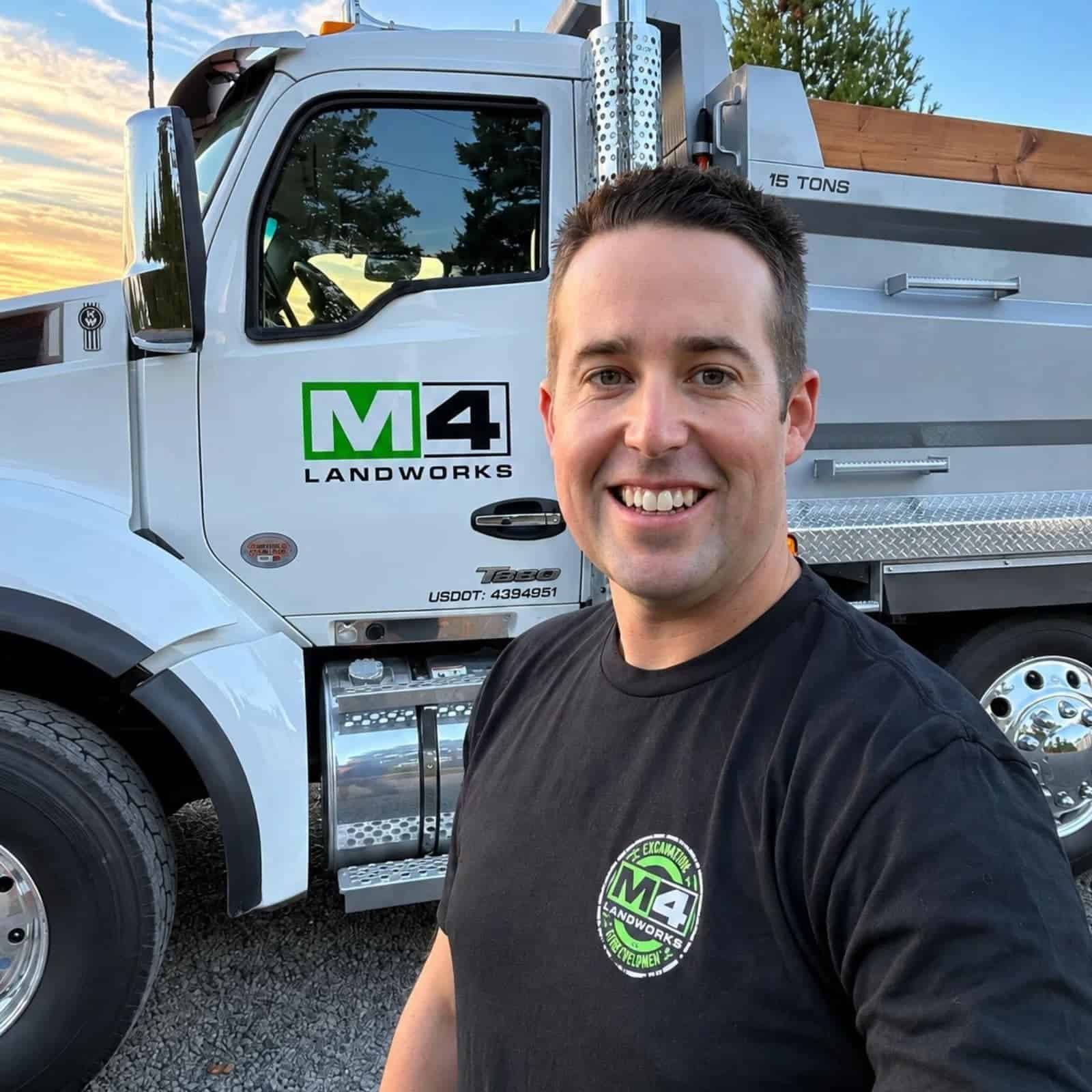 Curtis Miller, owner of M4 Landworks, standing beside an M4 Landworks truck in Columbia County, Oregon