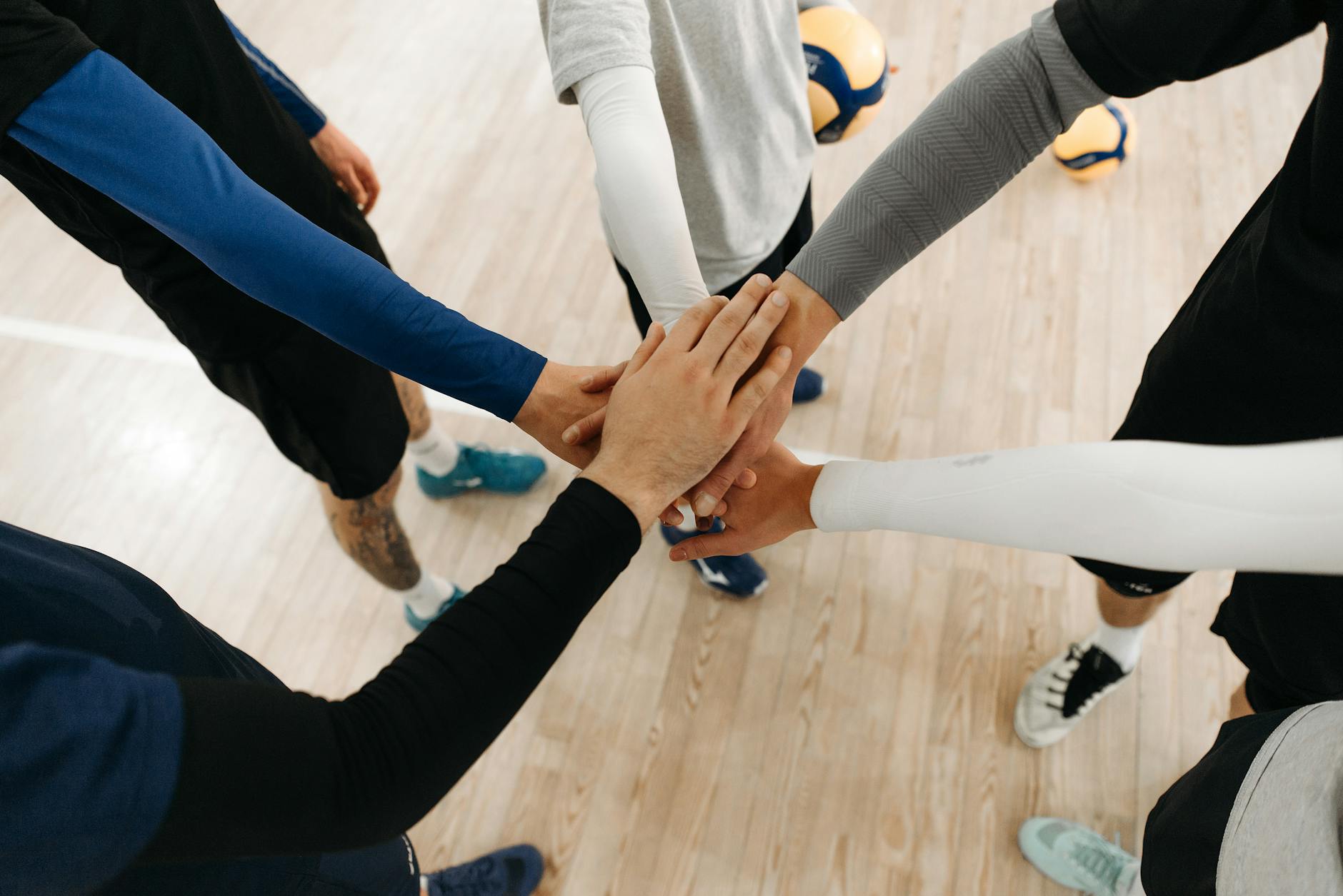 hands of team standing together