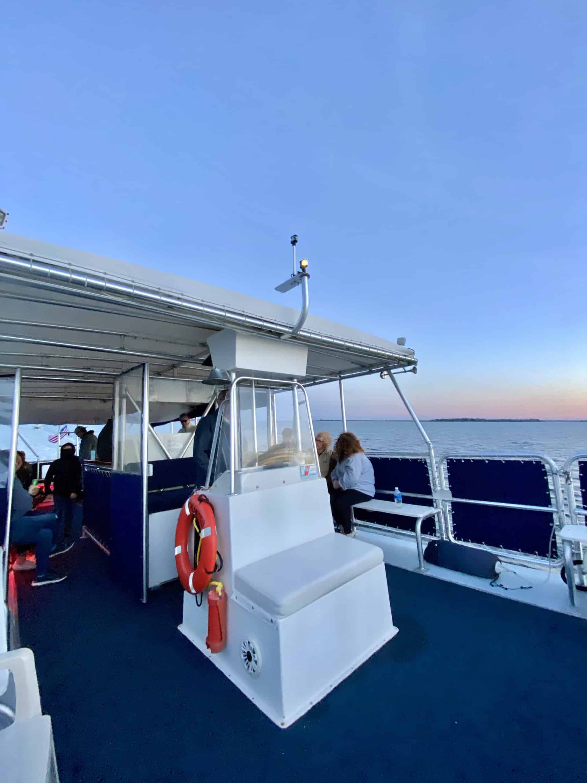 Group of people enjoying the sunset on the water. Private charter Charleston, SC
