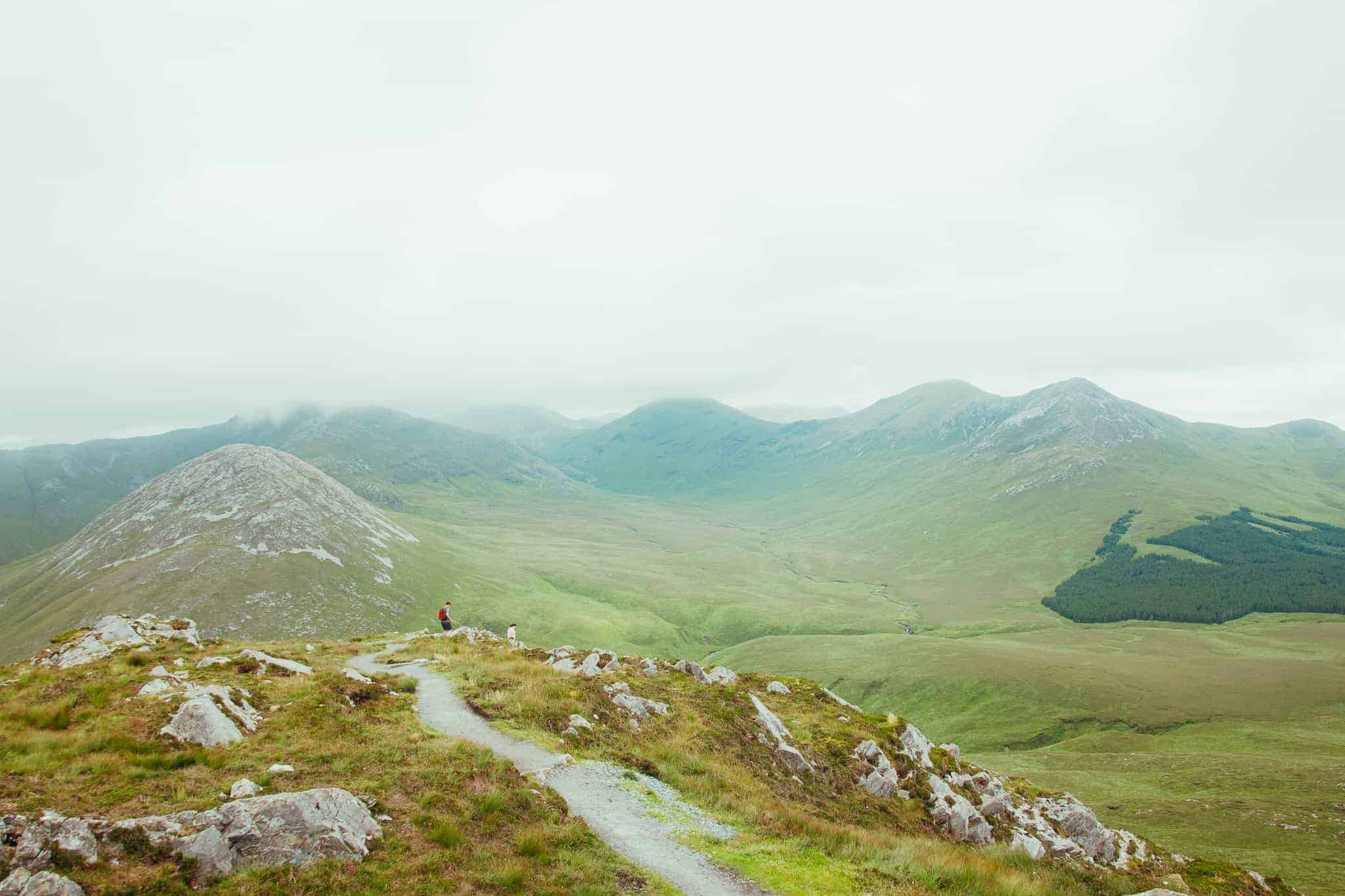 A gravel path on Diamond Hill, with views of lakes and hills in the distance.