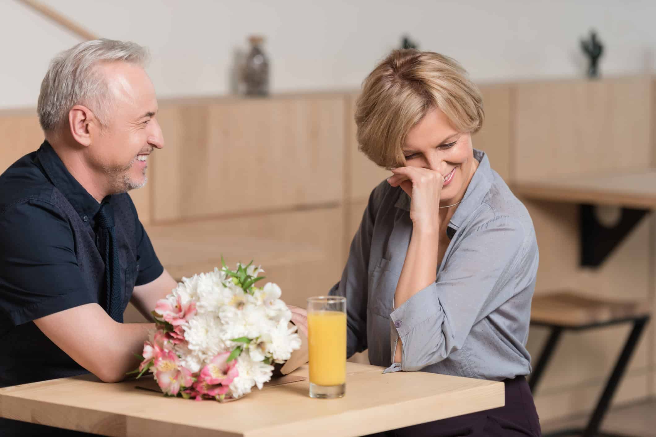 Middle-aged couple on a date, realizing that it's not too late for love!