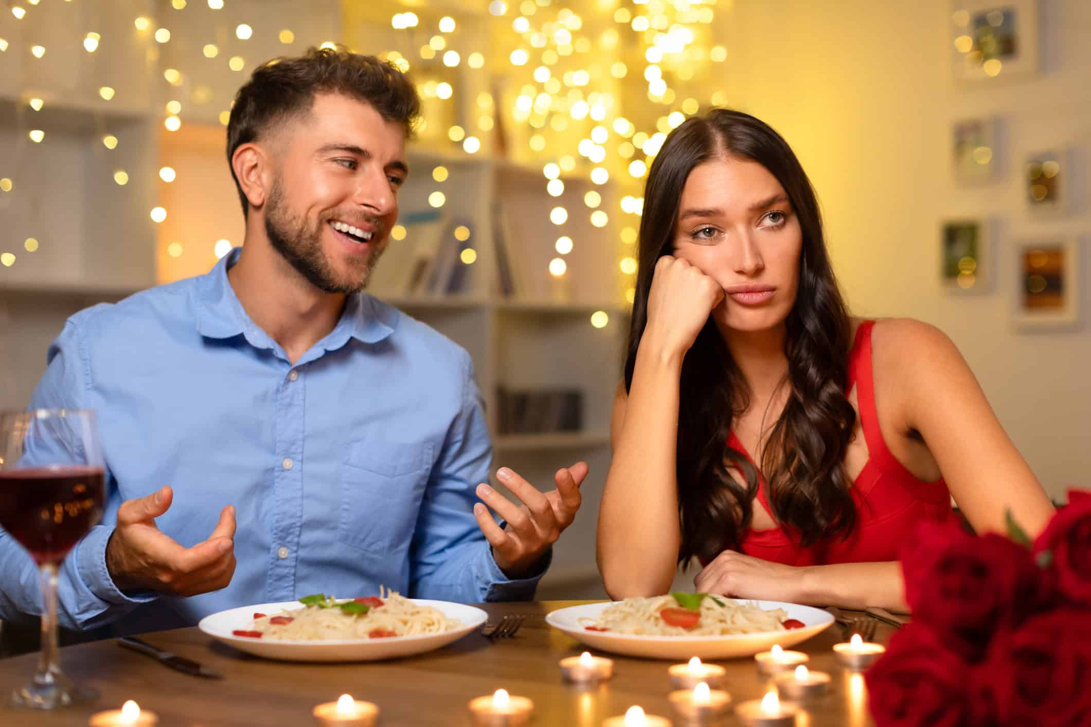Woman on a date looking bored and annoyed, and wondering “Why do we want people who don’t want us?”.