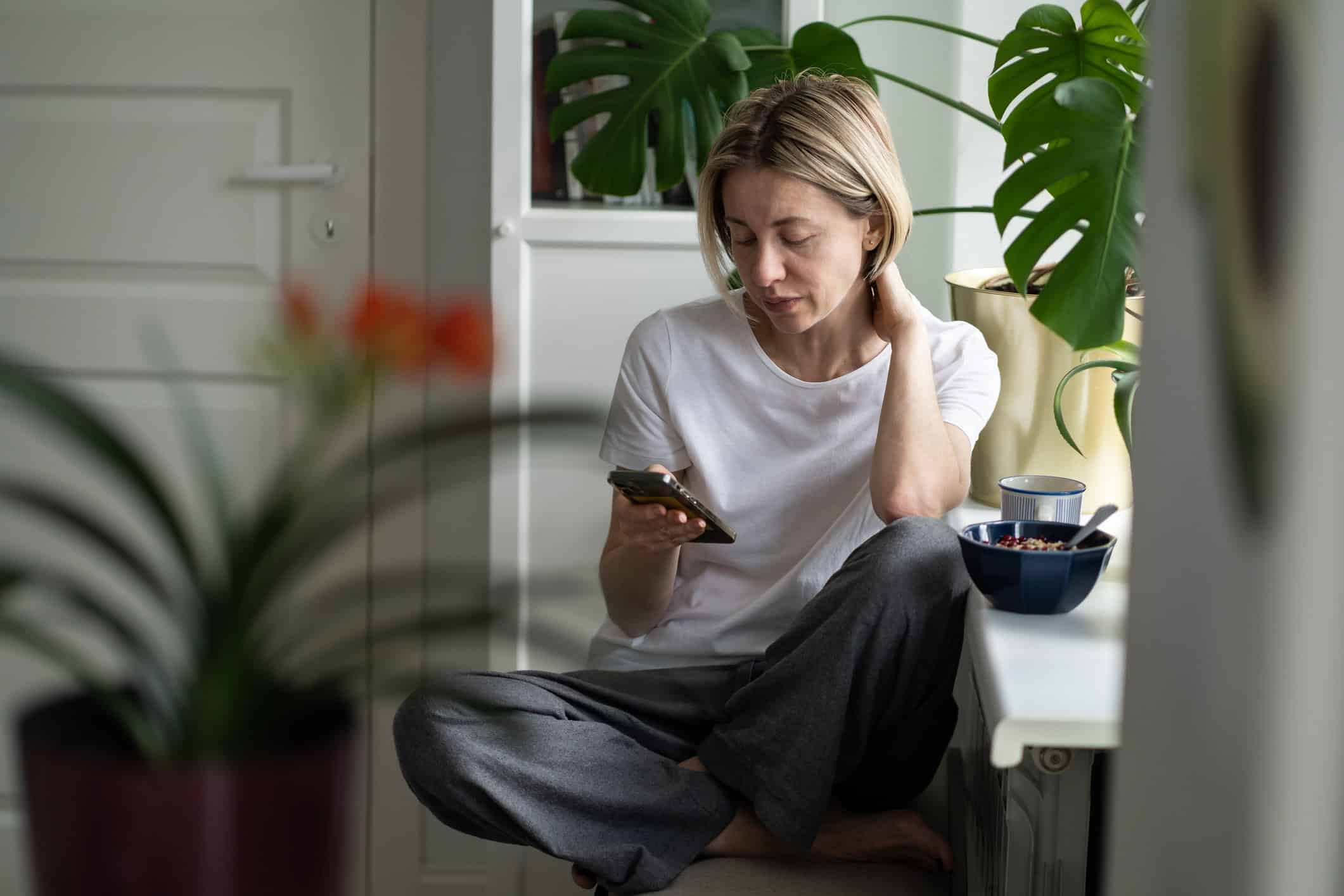 Woman wistfully scrolling through on online dating site wondering will I ever find true love...