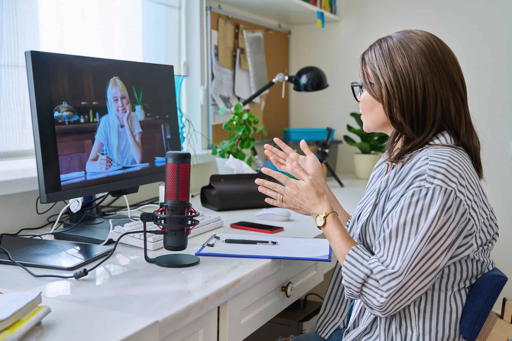 Online dating coach talking with a client over Zoom.