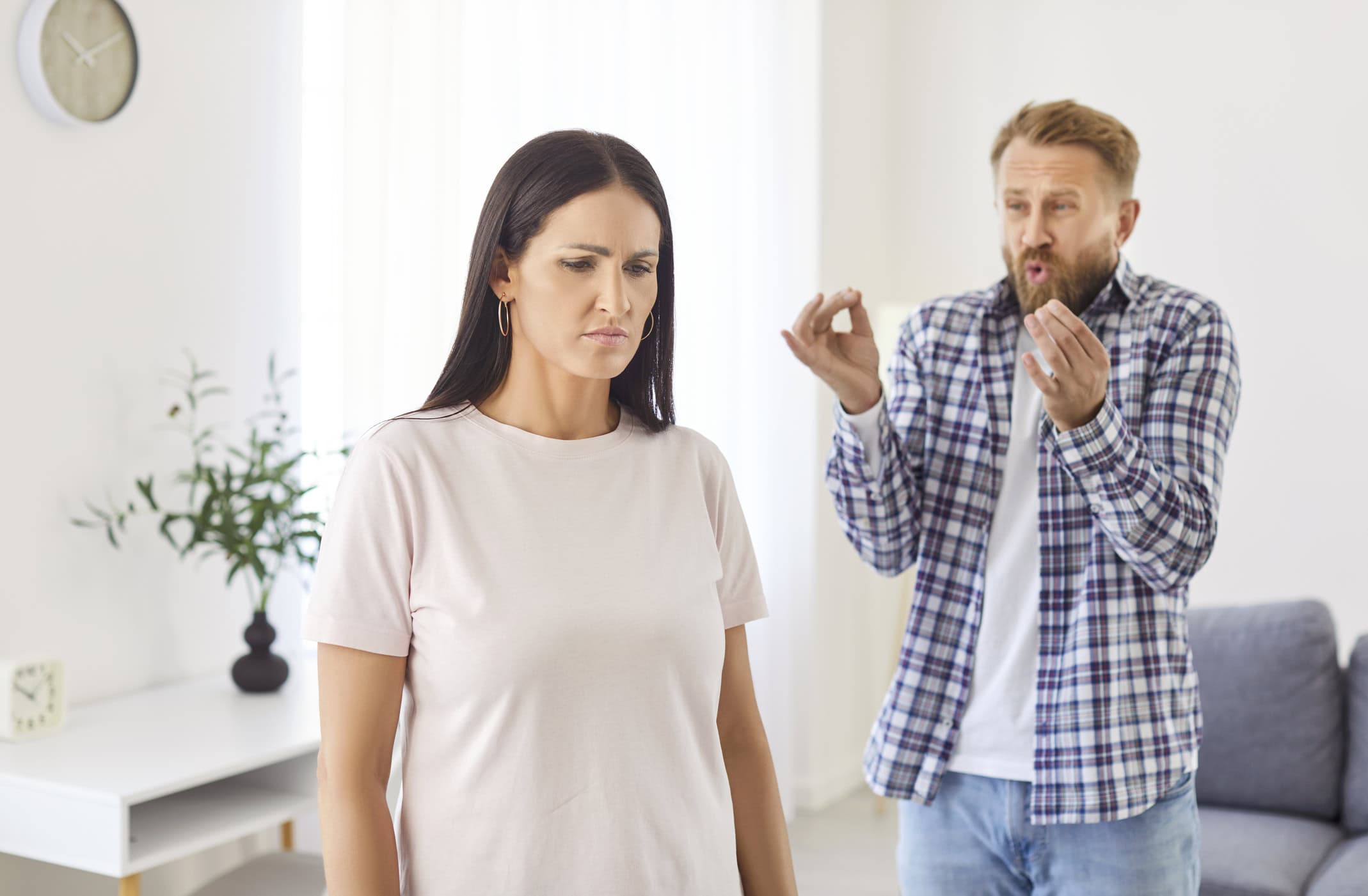 A sad woman, being yelled at by her partner, is wondering, "Why do I attract toxic people?"