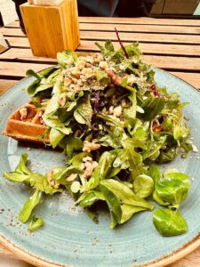 Waffles topped with rocket leaves and pine nuts, just one of the many culinary delights to be enjoyed during an adventure day tour of Europe in Prague.