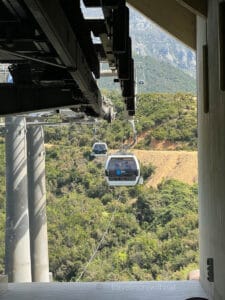 A Dajti Express Cable Car arrives at the station to collect new passengers to take up Mount Dajti. A thrilling day trip in Europe for those who love heights.