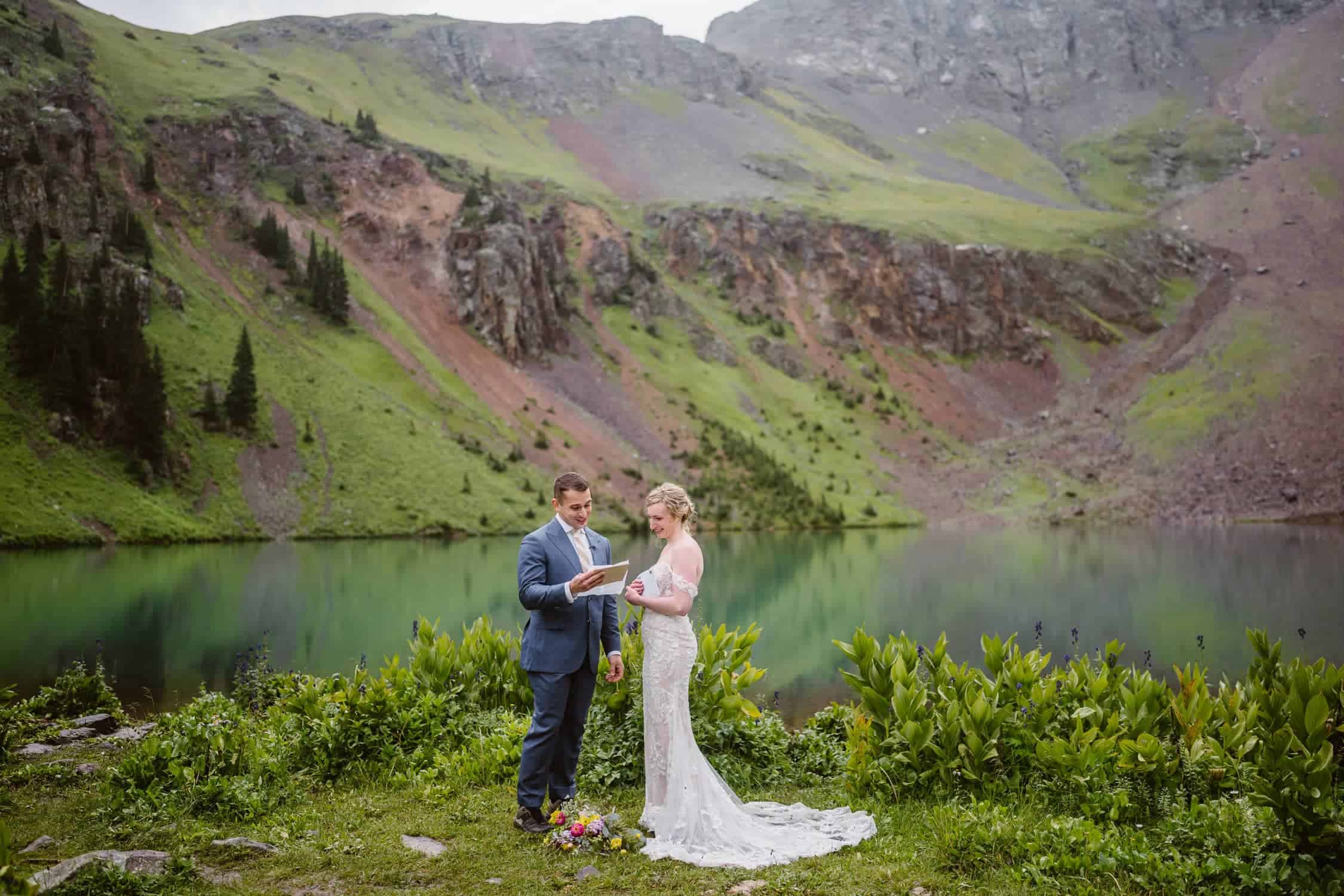 A couple reading letters from friends and family on their elopement.