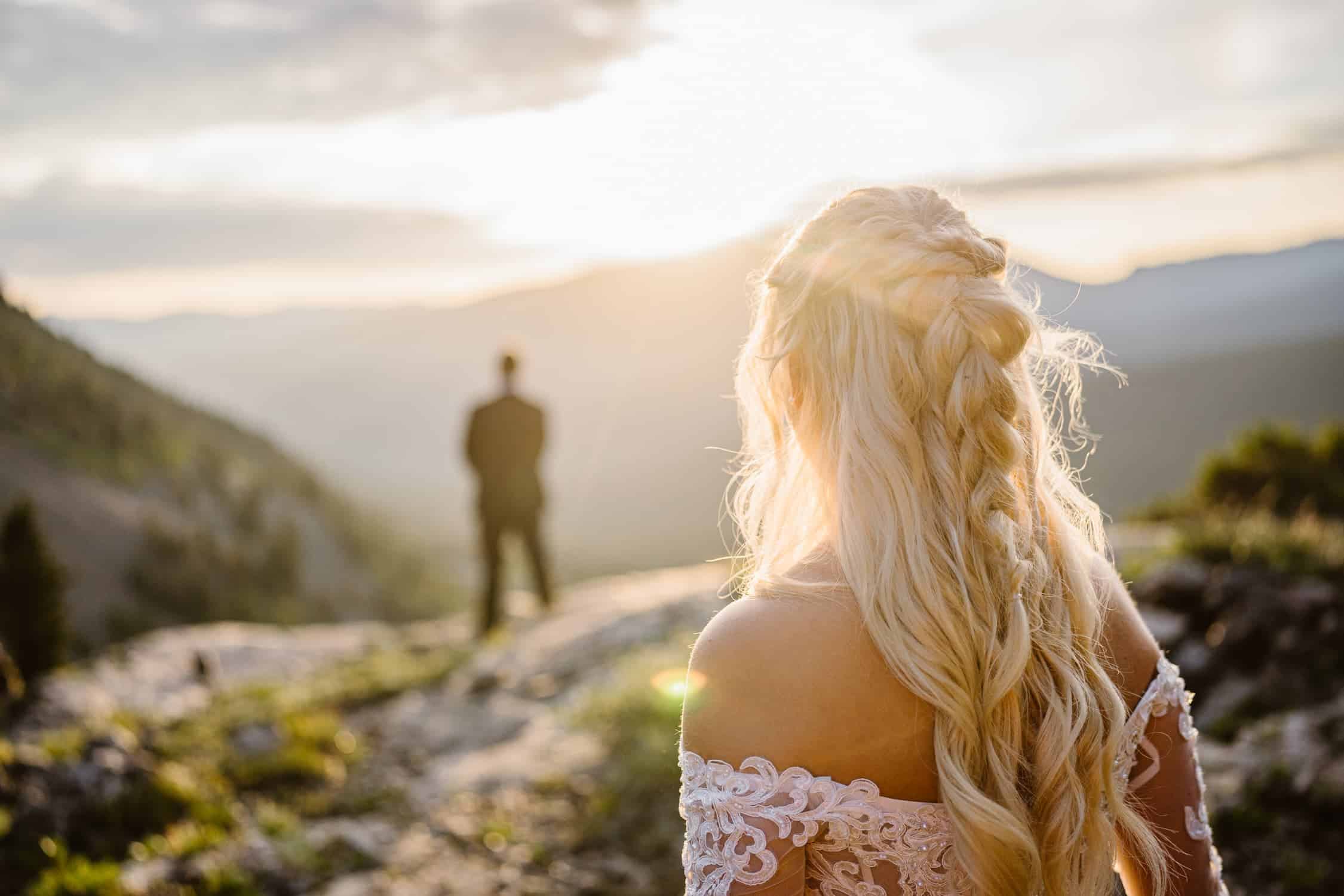 A bride getting ready in the woods for her elopement.