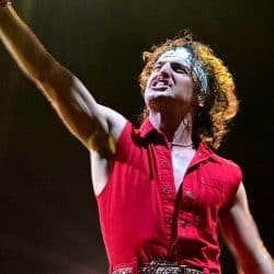 Leather Rebel Rocker Performing Live Rock Concert with Intense Expression and Dynamic Stage Presence.