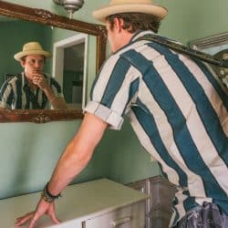 Male Musician looking in the mirror