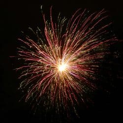 Bright fireworks explosion lit up the night sky, creating a colorful display for celebration and entertainment. Perfect for events, festivals, or New Year's celebrations, capturing the excitement of fireworks.