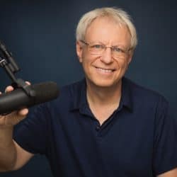 Popular music industry podcast host with microphone in recording studio for music industry insights and digital marketing strategies.